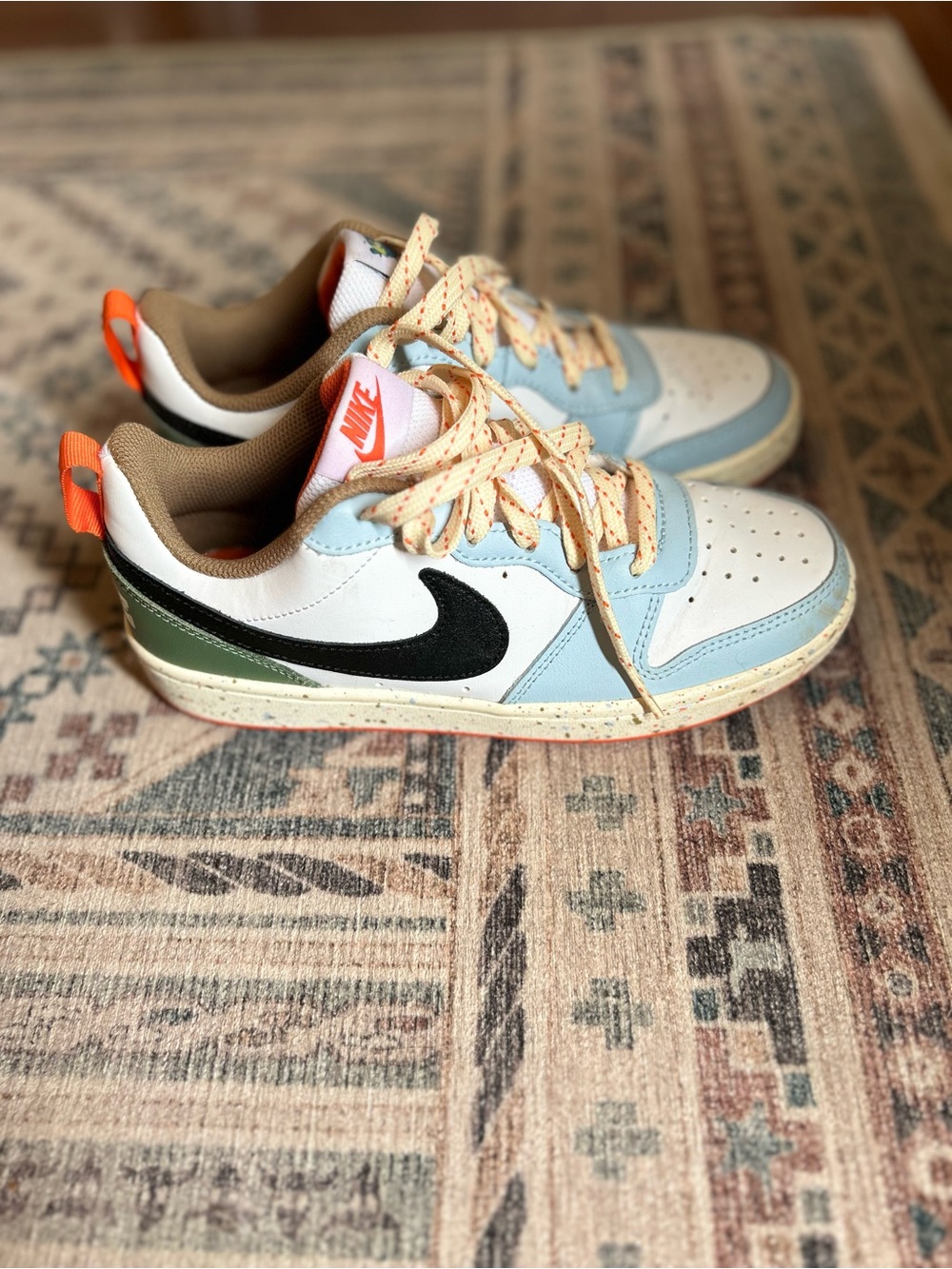 Nike Kids Low-Top Sneakers in White, Light Blue, Black & Orange Accents